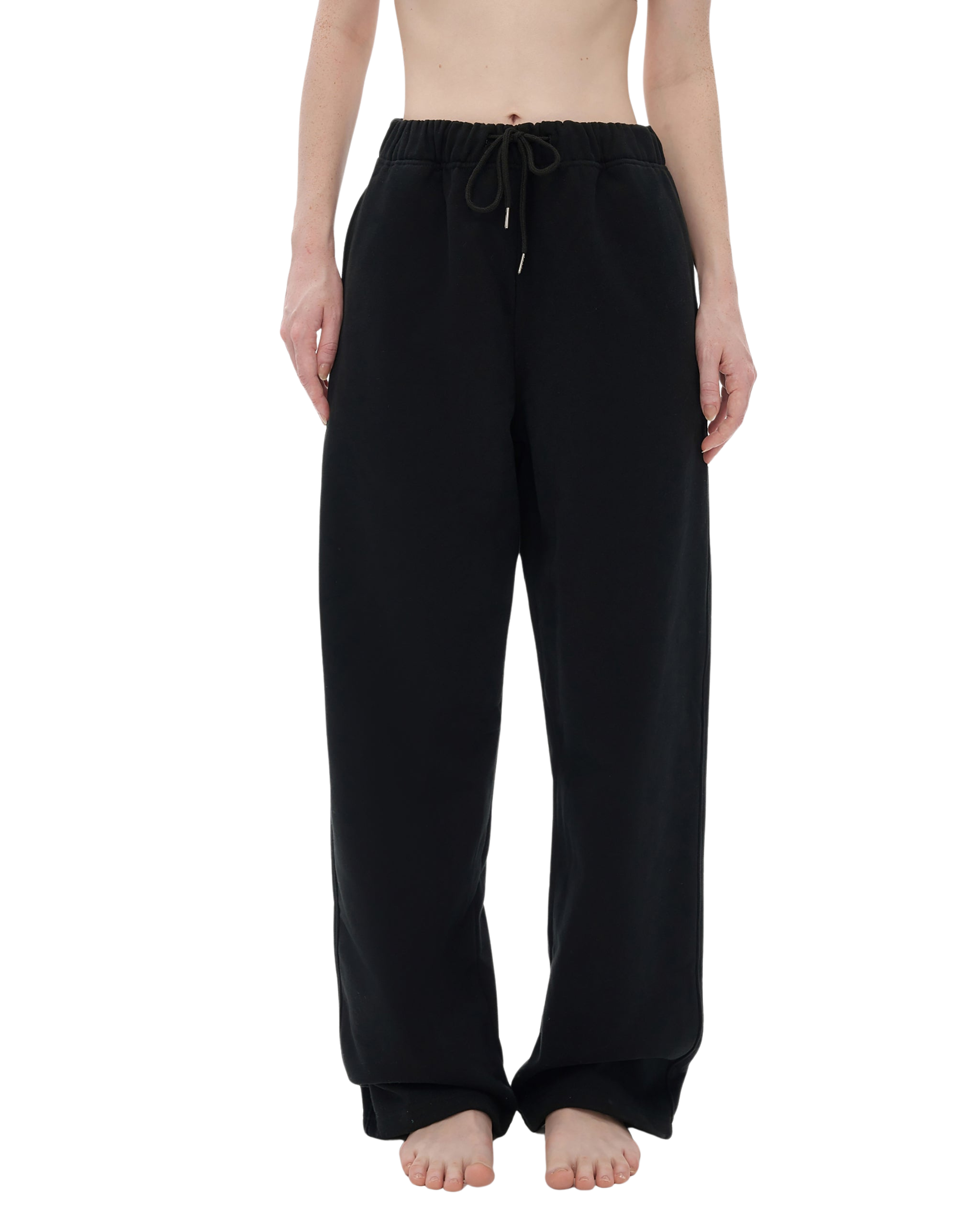 Black pants worn by a person on a white background