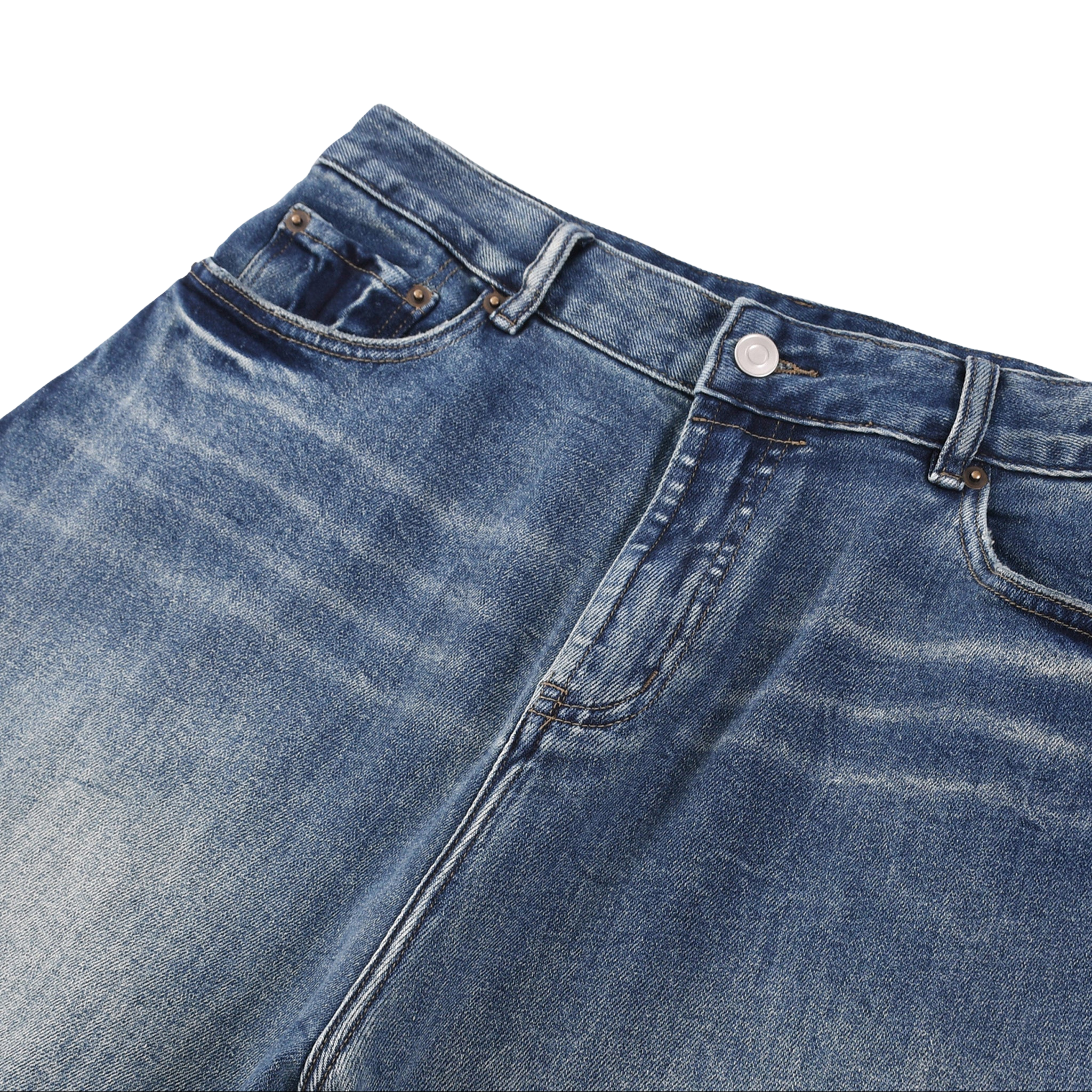Close-up of blue denim jeans on a white background