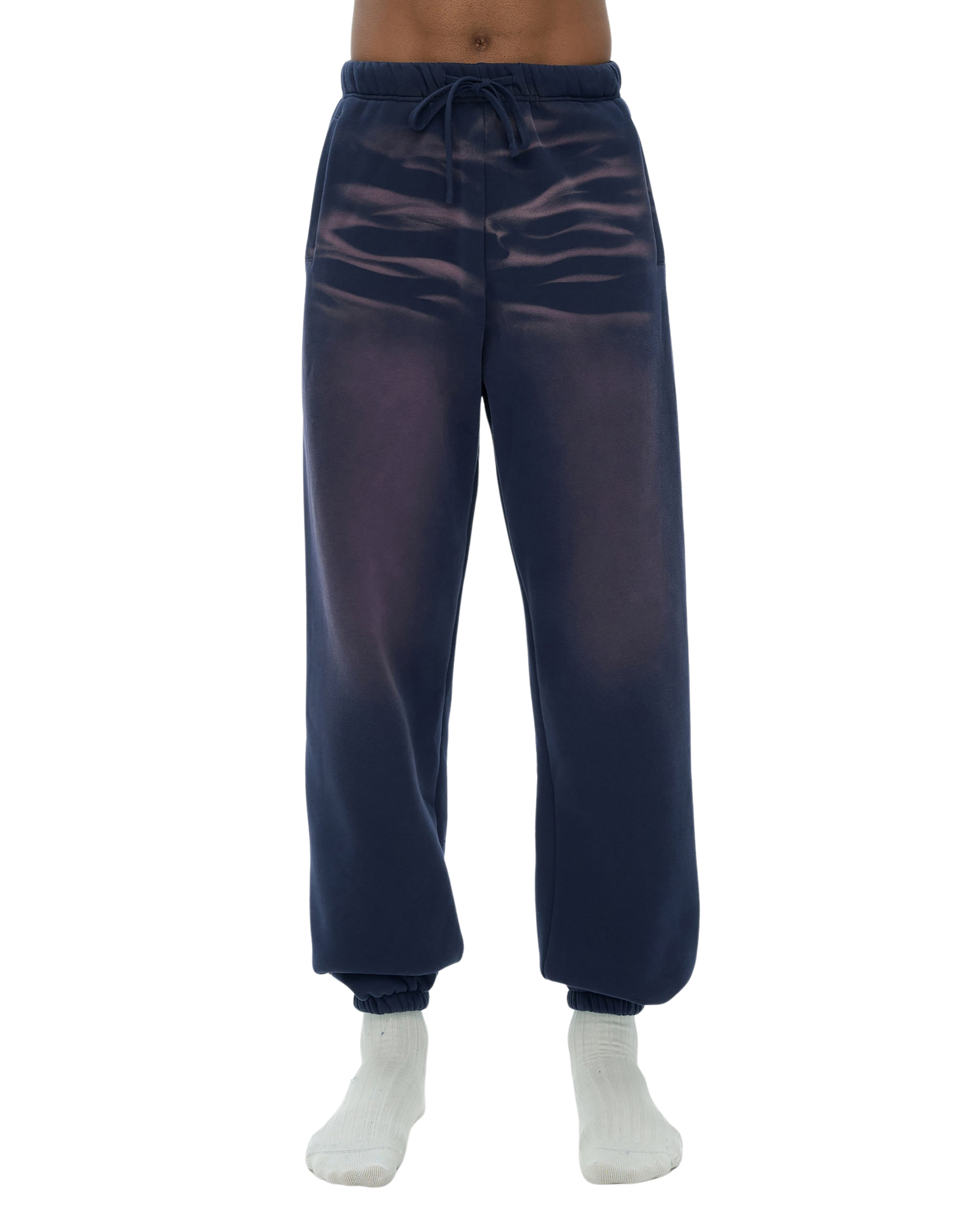 Navy blue sheer jogger pants worn by a person on a white background