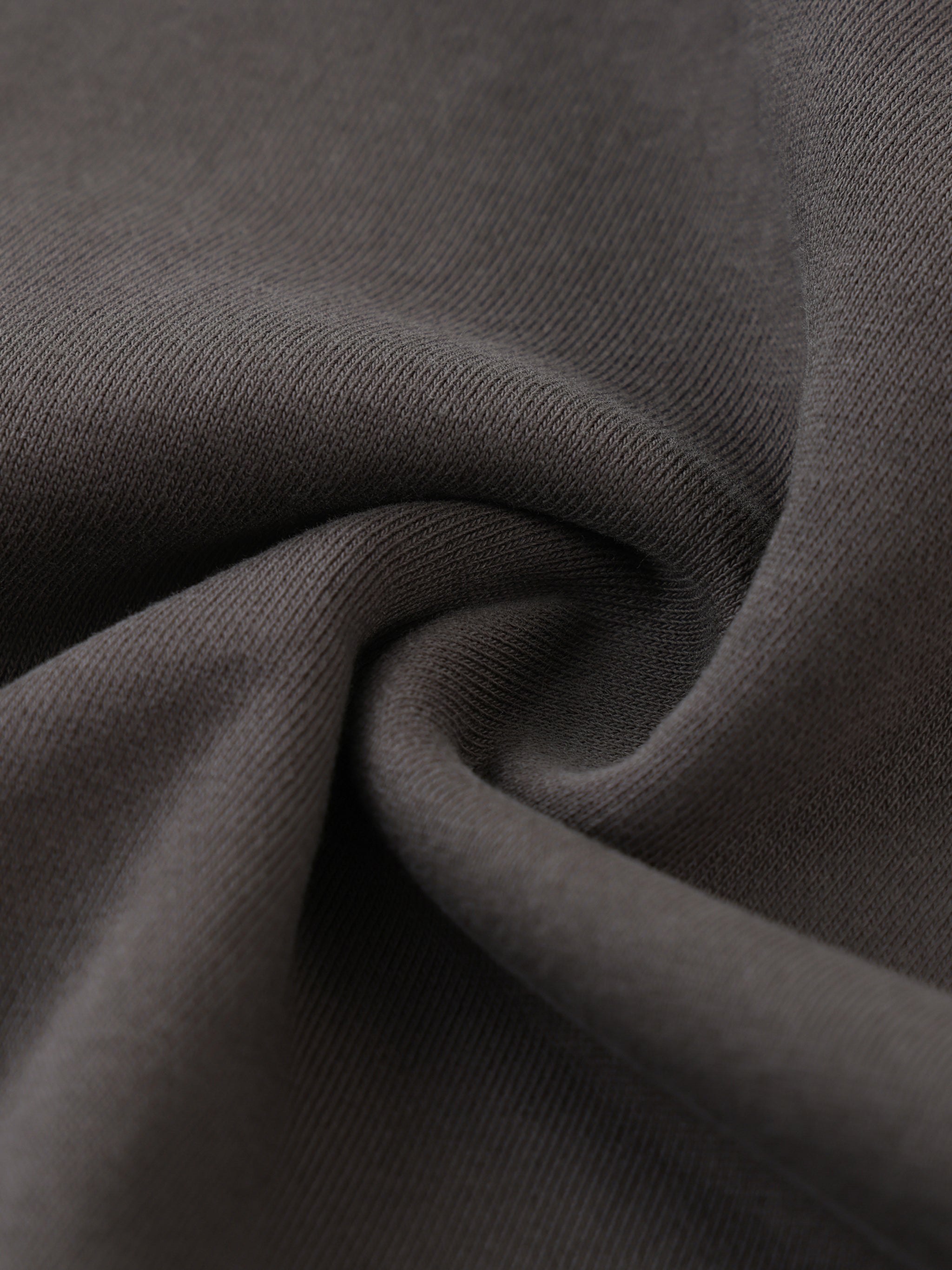 Close-up of dark gray fabric with visible texture