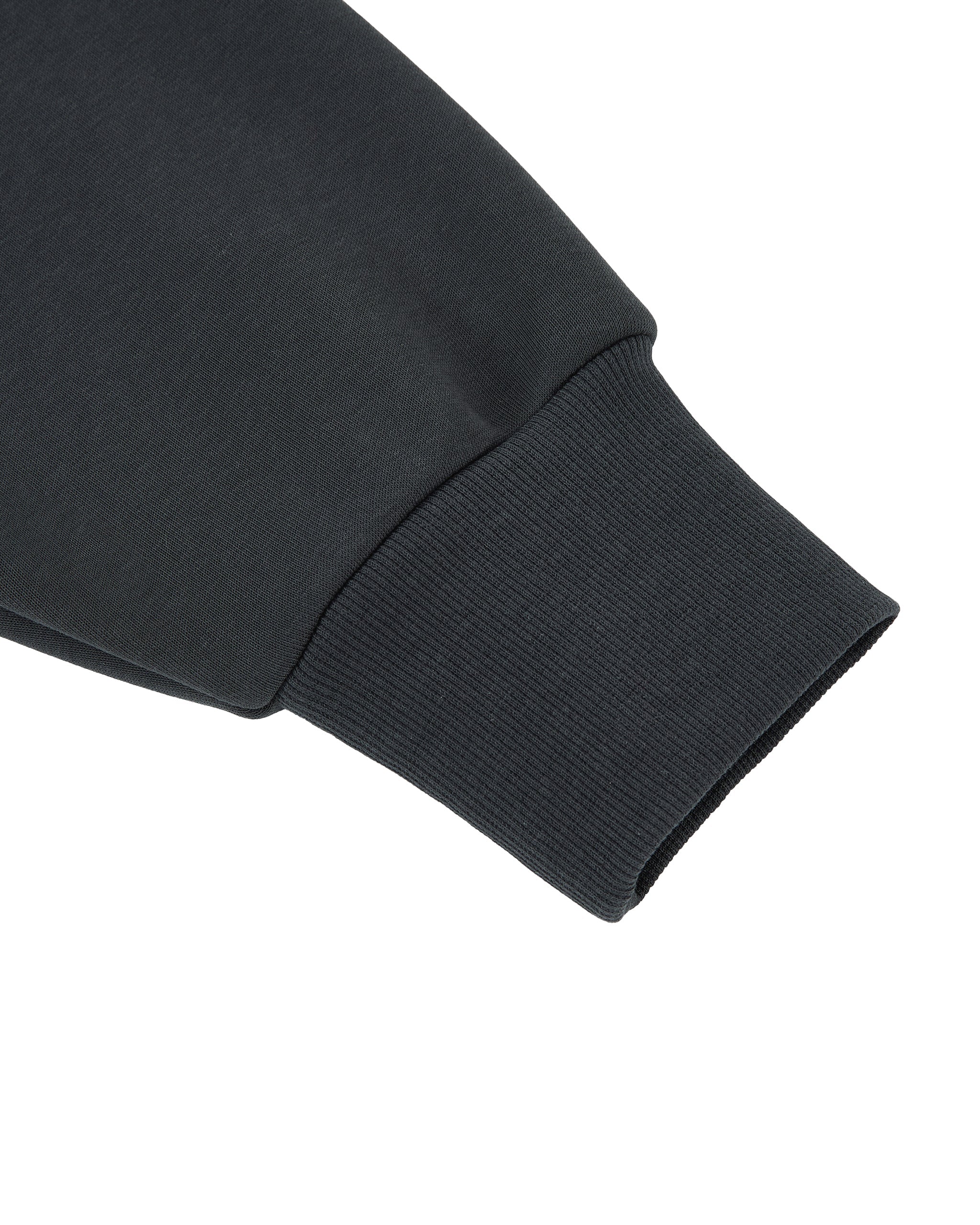 Close-up of a black sleeve on a white background