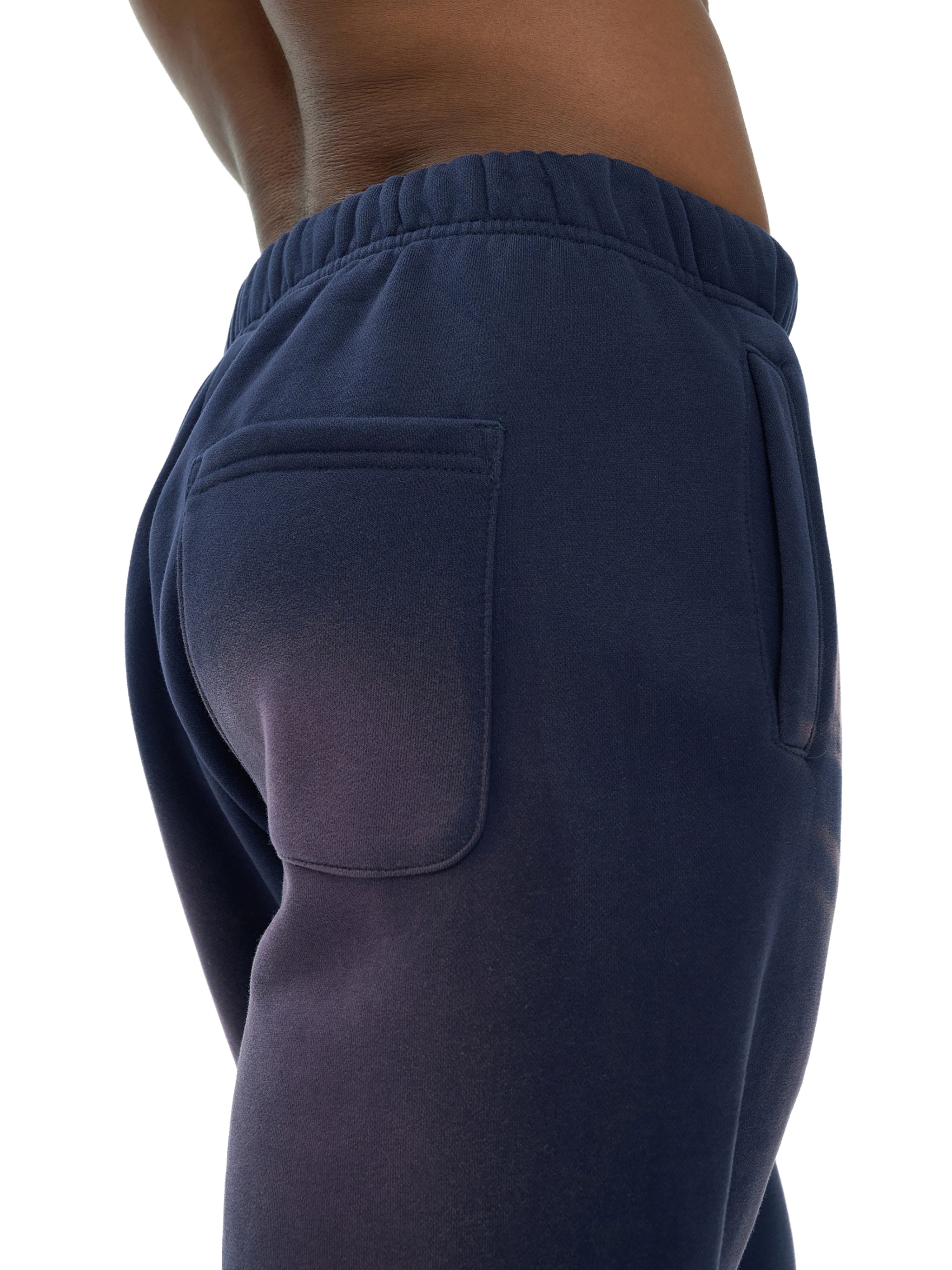 Navy blue sweatpants with a pocket on a white background