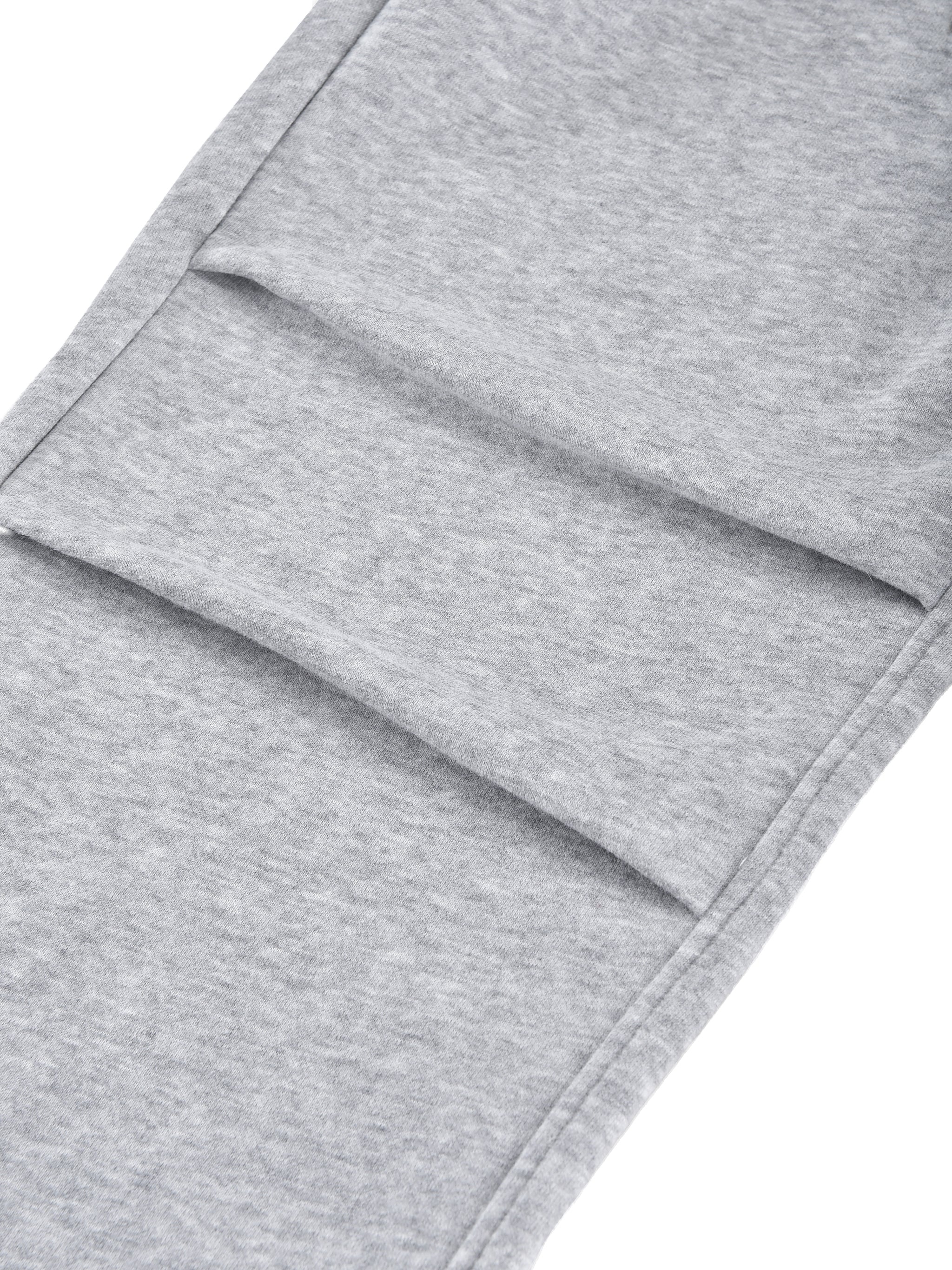 Close-up of gray sweatpants with a white background