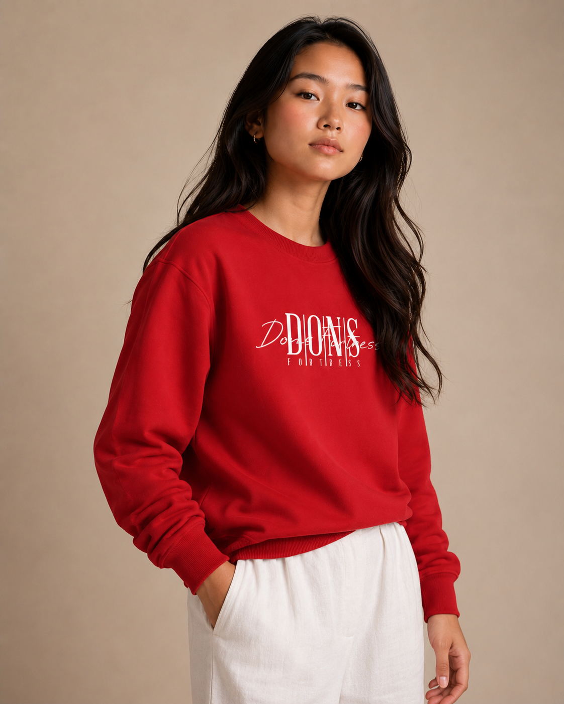 Person wearing a red sweatshirt with text on a beige background