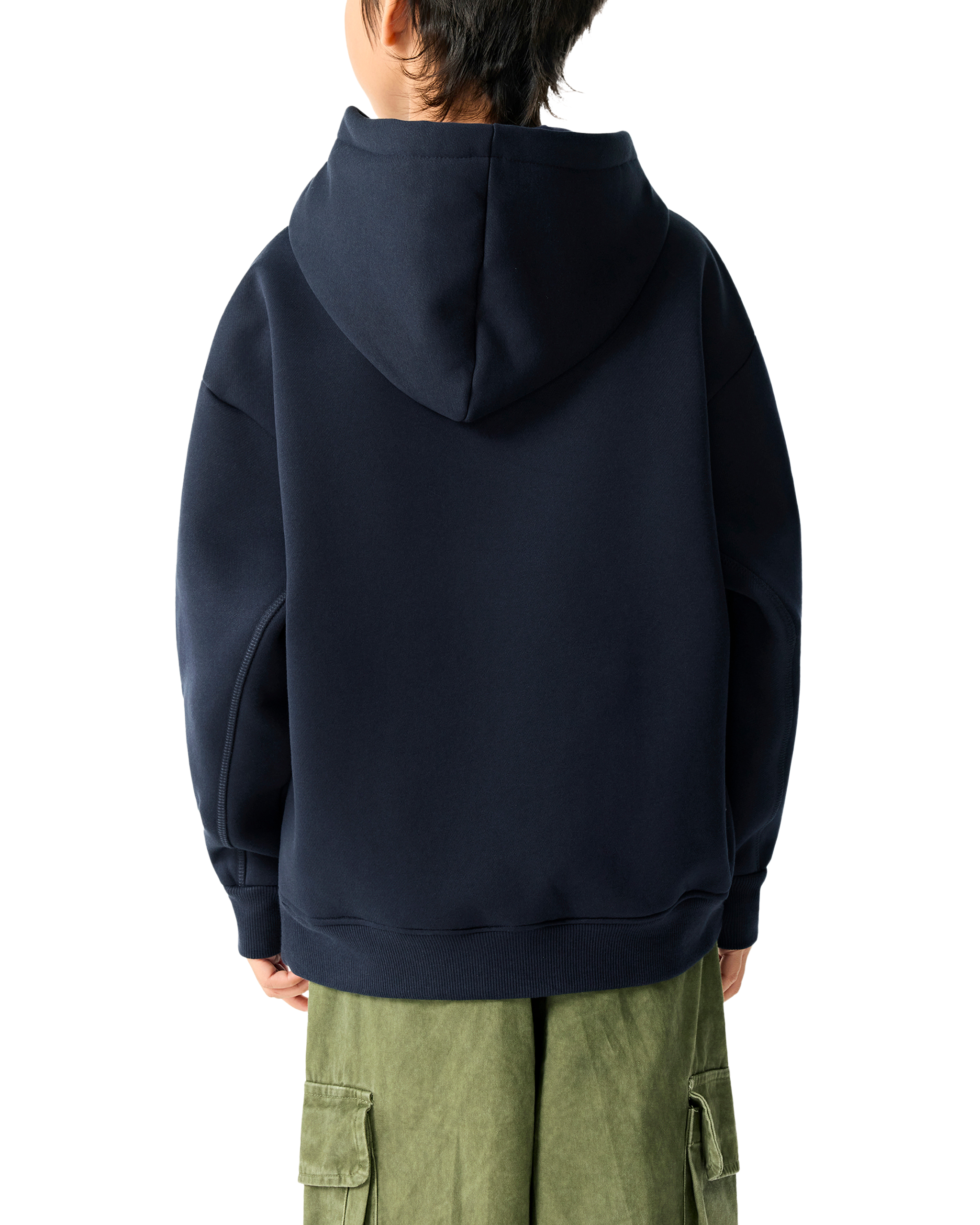 Person wearing a navy blue hoodie and green cargo pants on a white background