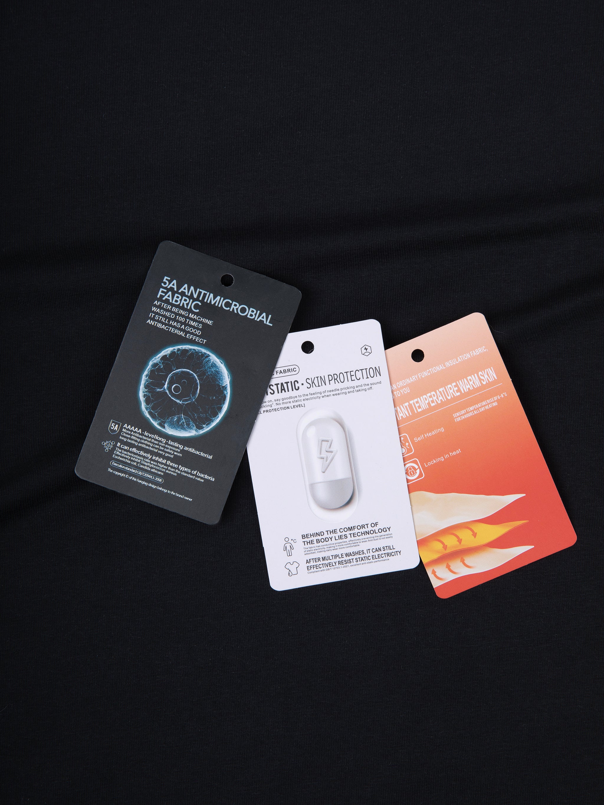 Three product packaging cards on a black background