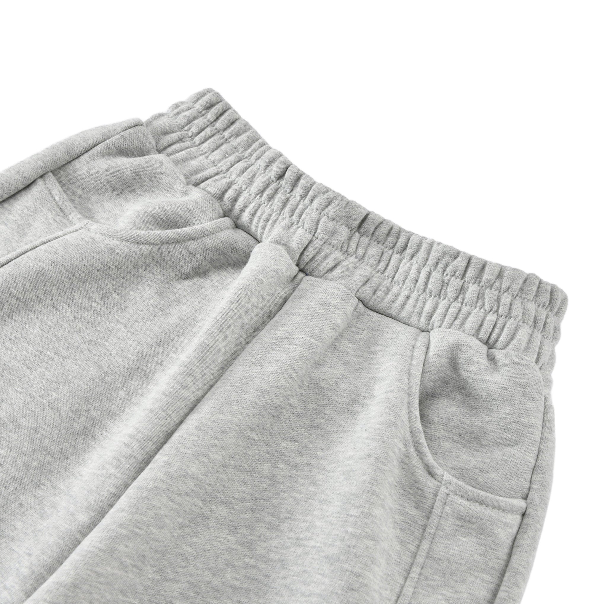 Close-up of gray sweatpants on a white background