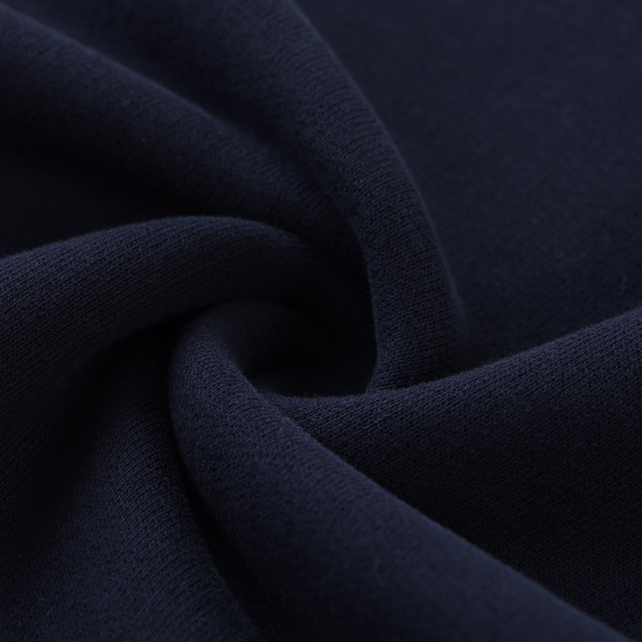 Close-up of dark blue fabric with folds