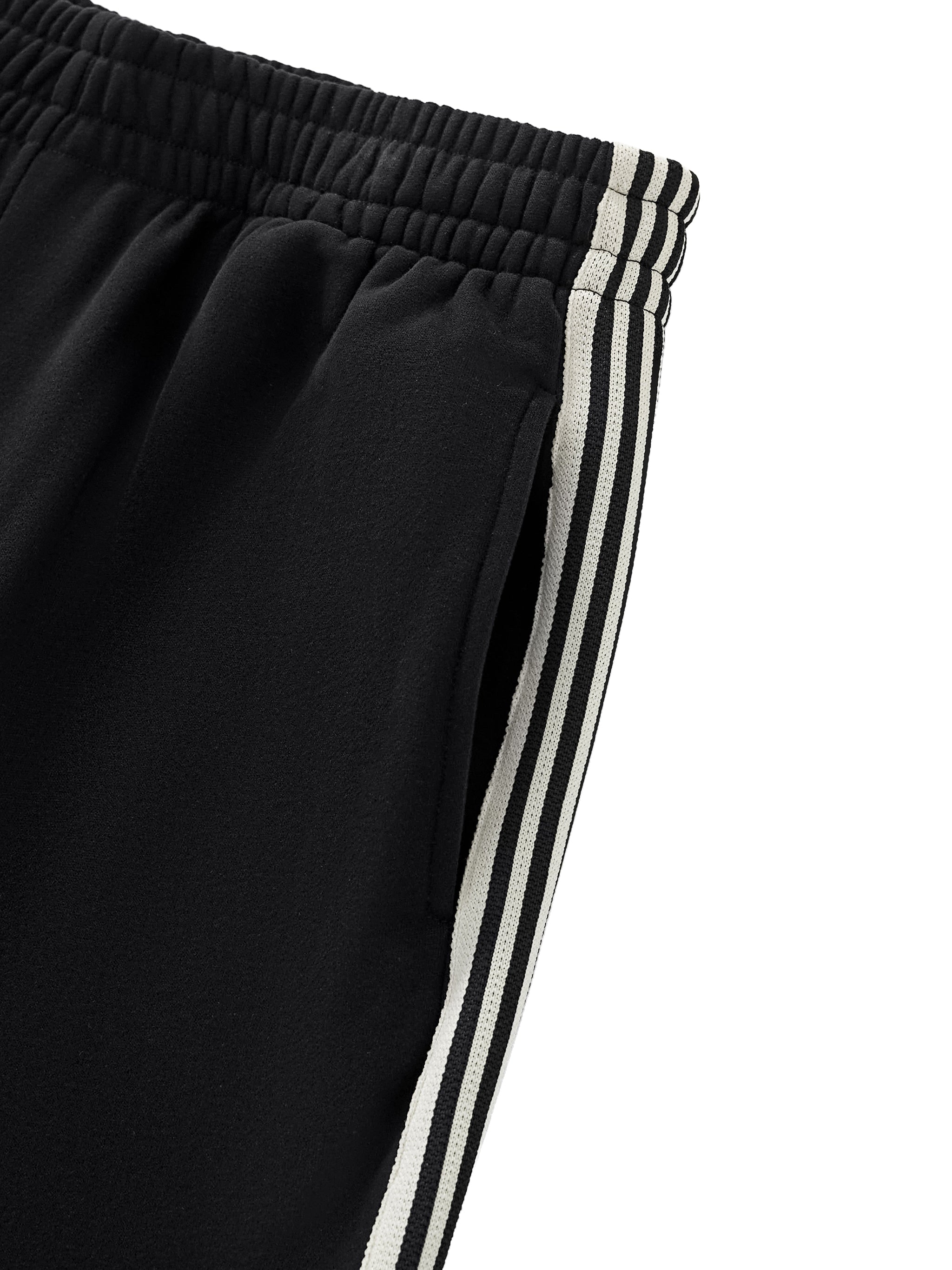 Black pants with white stripes on a white background