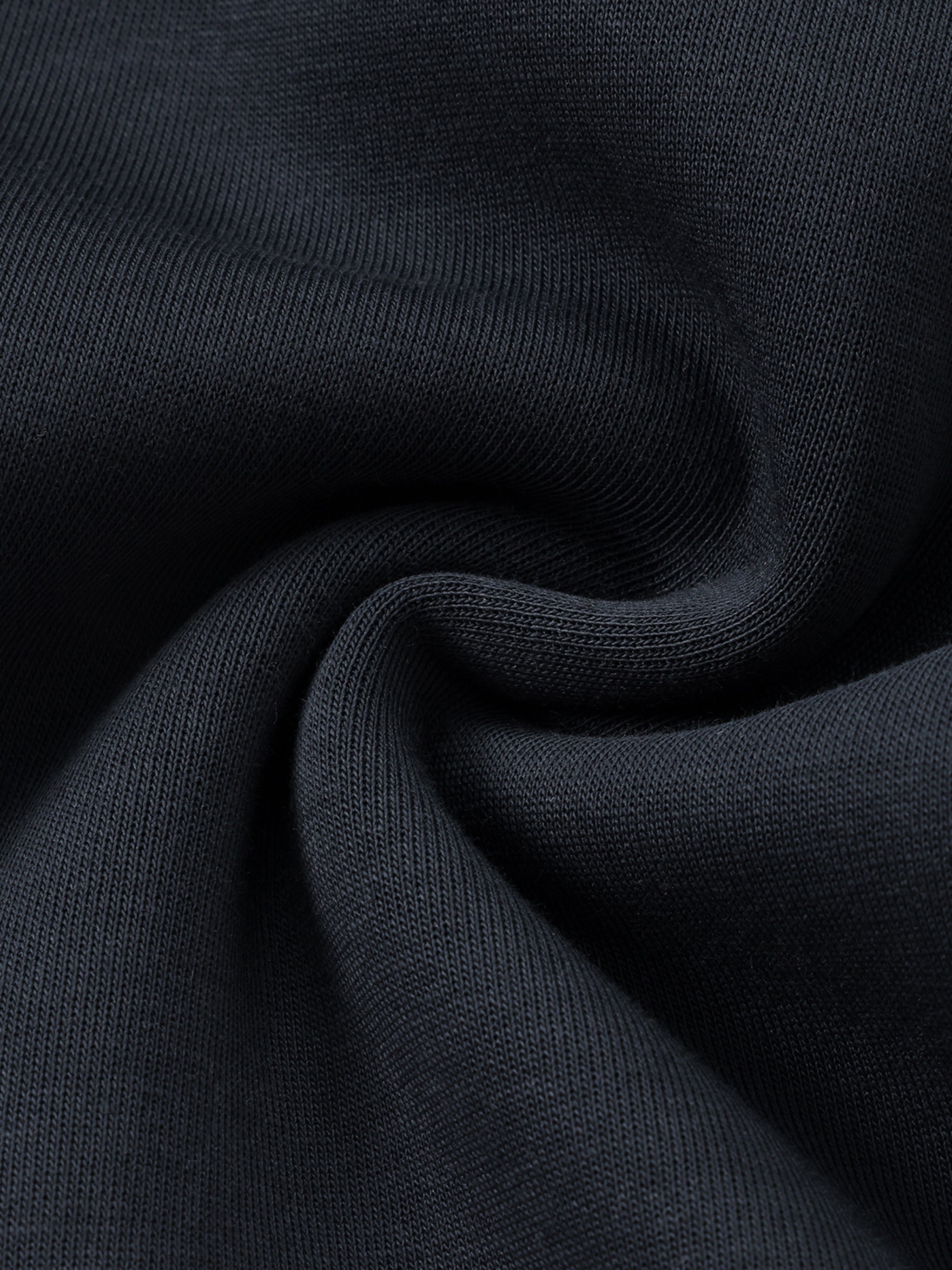 Close-up of dark blue fabric with a textured pattern