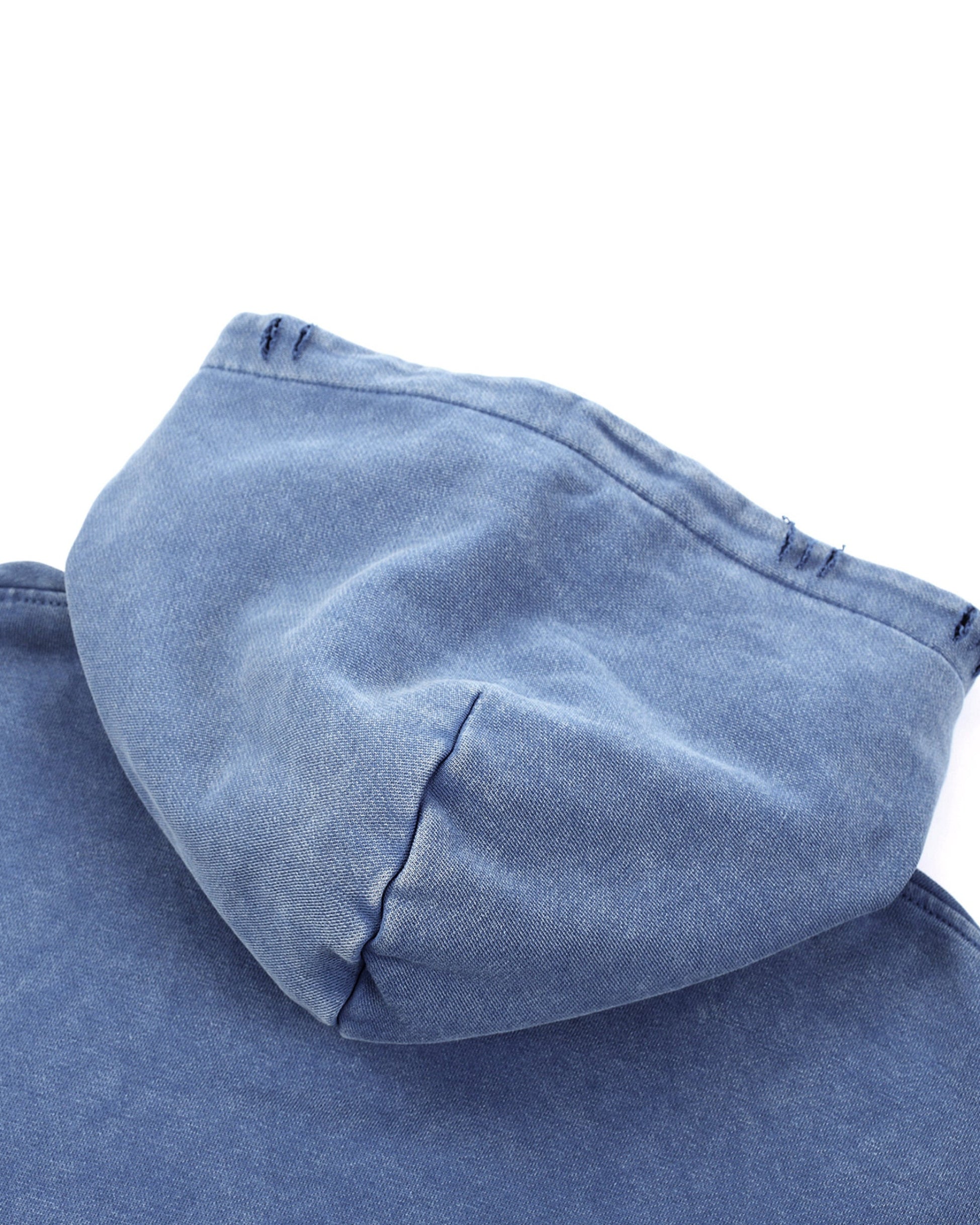 Blue denim fabric with a hood on a white background