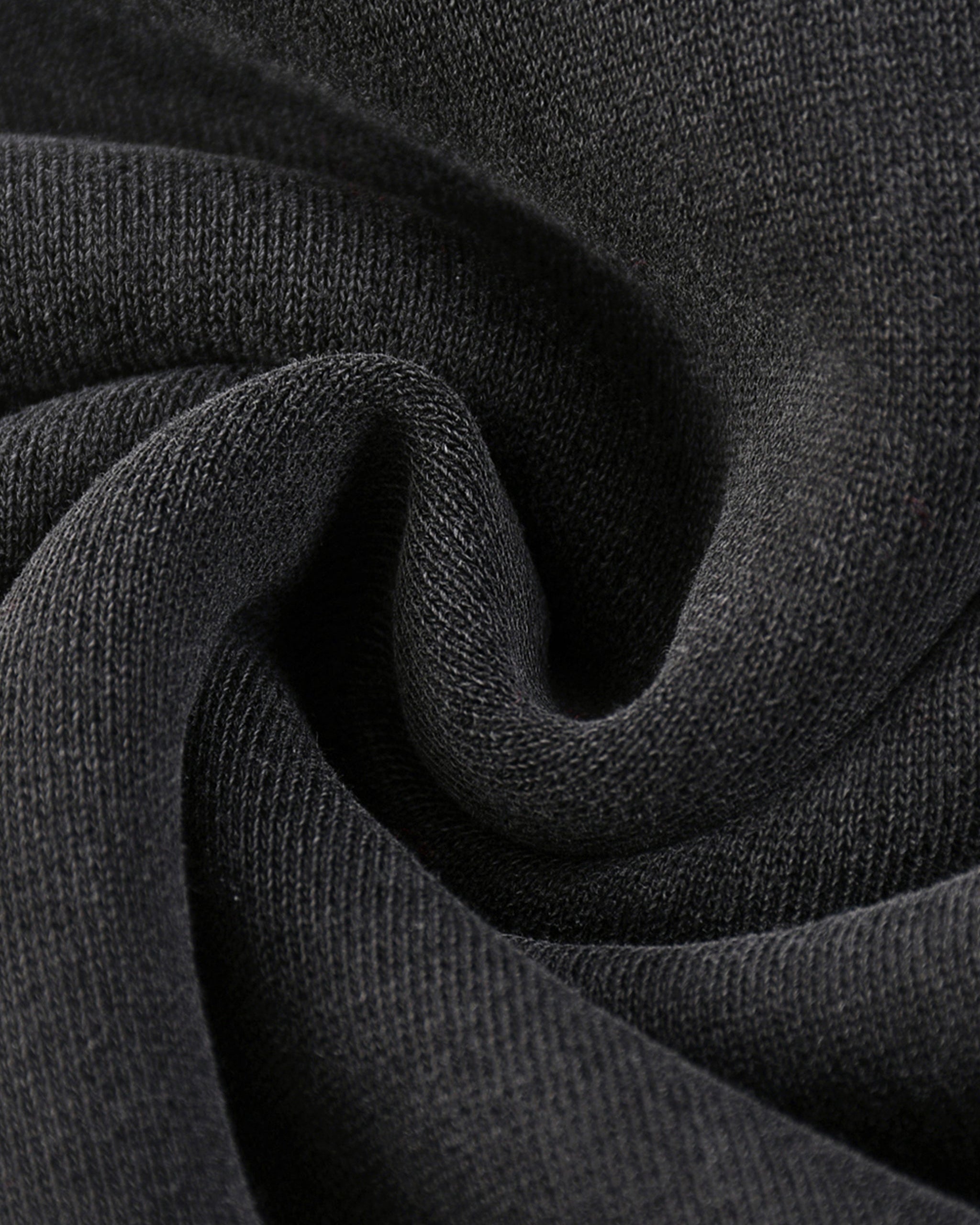 Close-up of dark gray fabric with a textured pattern