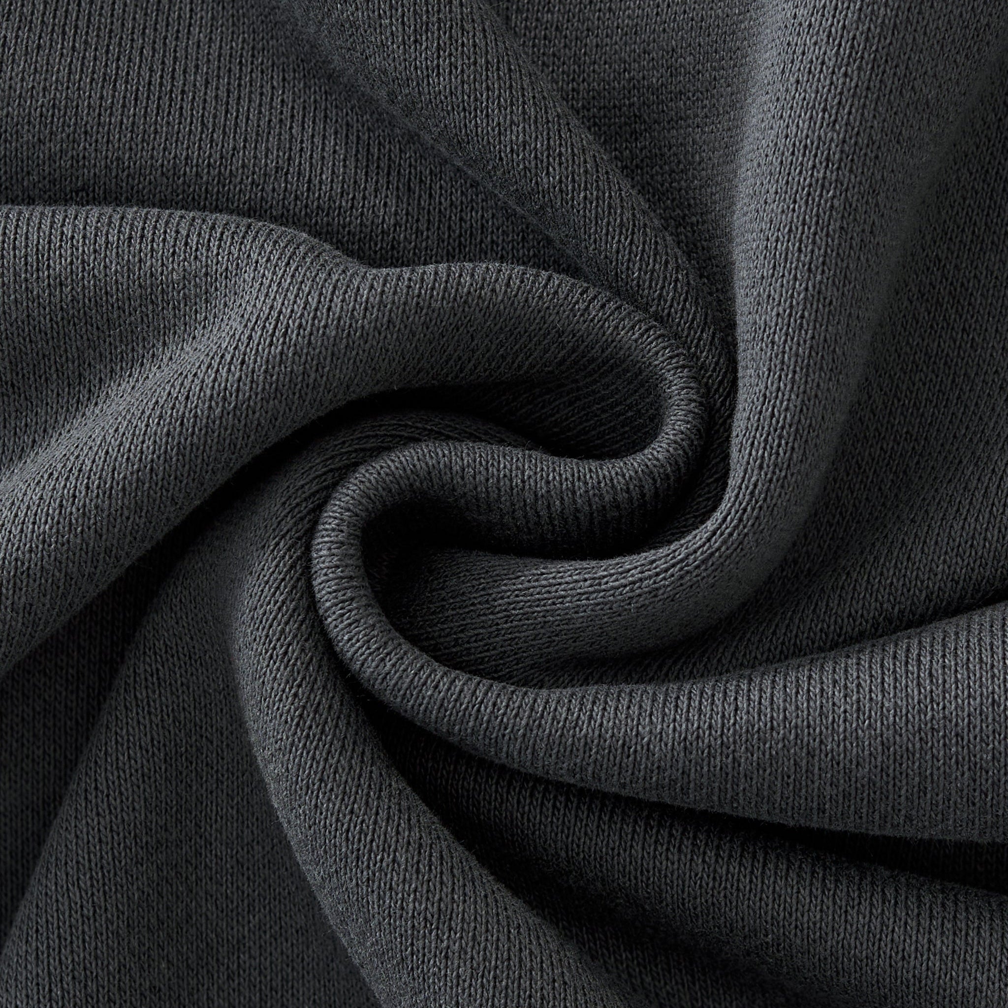 Close-up of dark gray fabric with folds