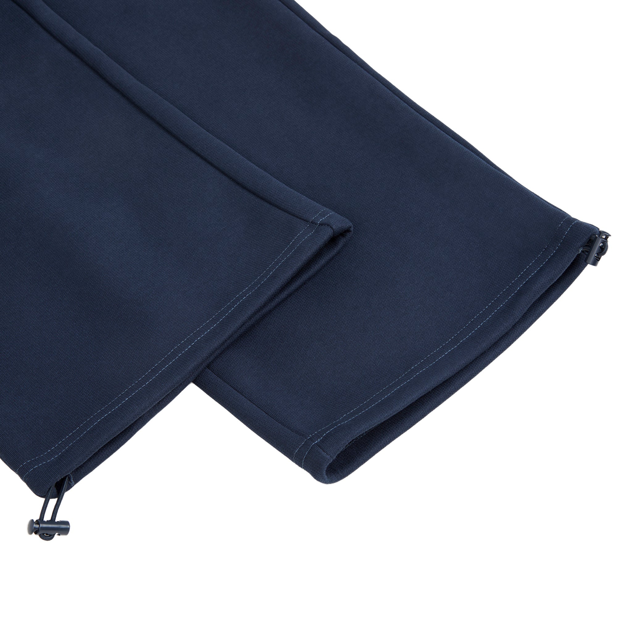 Folded navy blue fabric on a white background