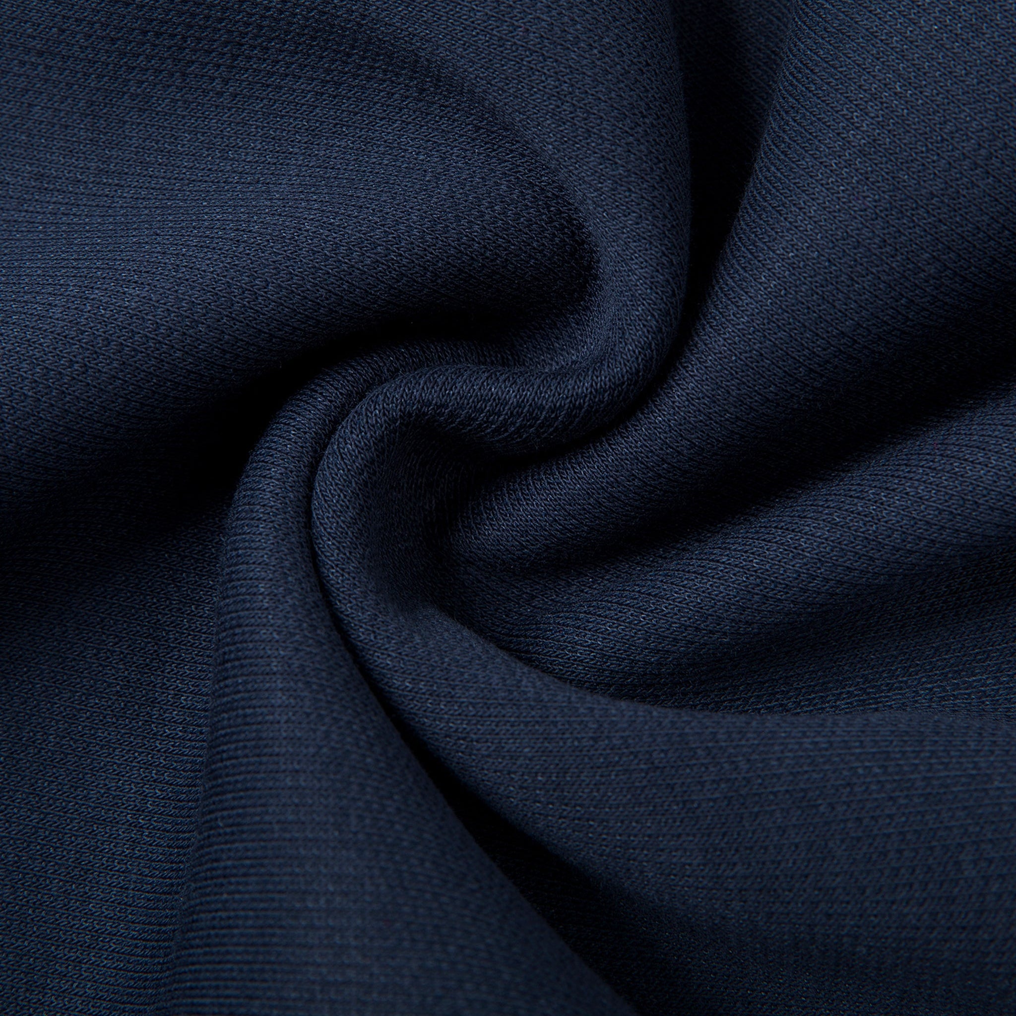 Close-up of dark blue fabric with folds