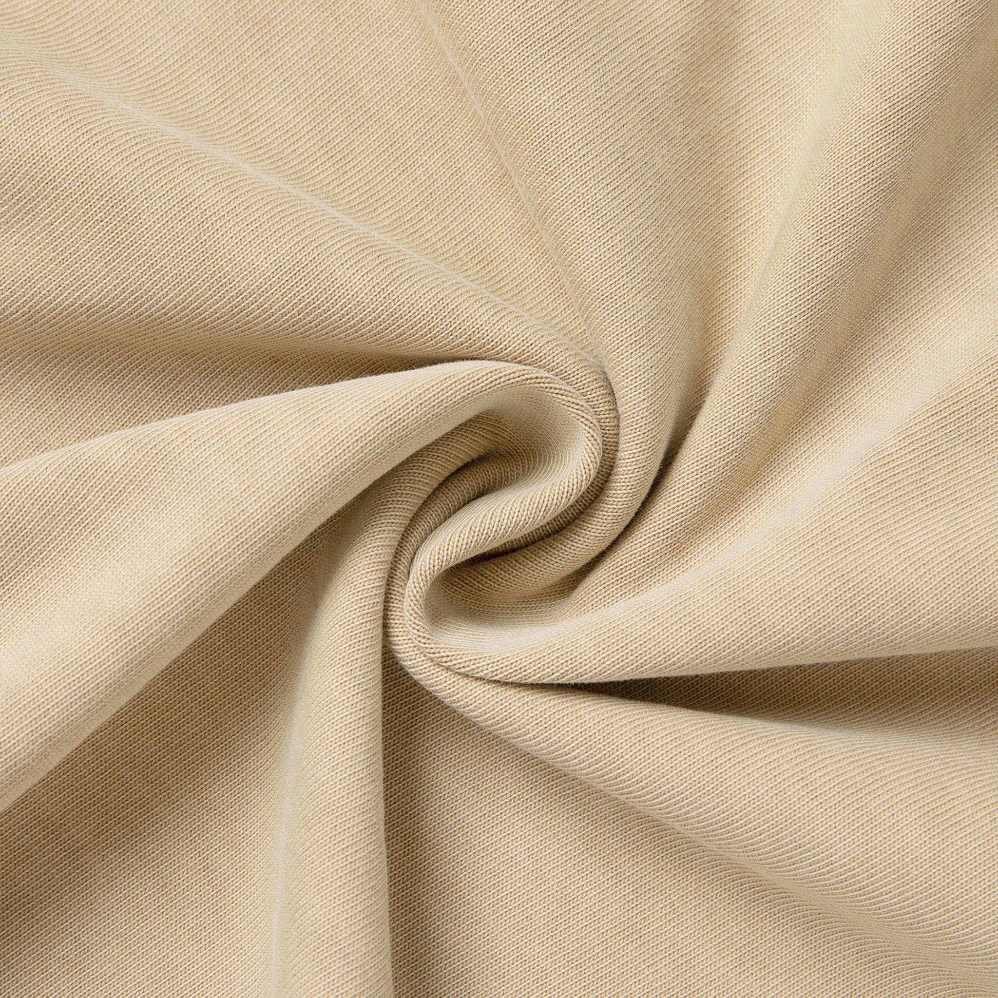 Close-up of beige fabric with folds