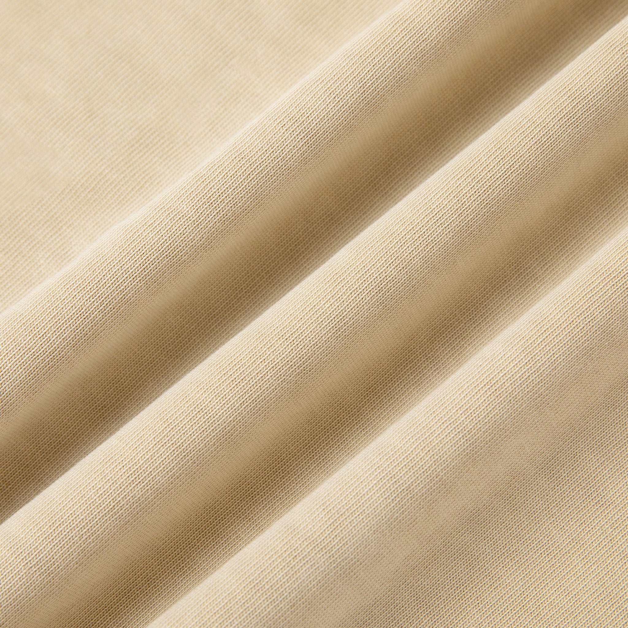 Close-up of beige fabric with folds
