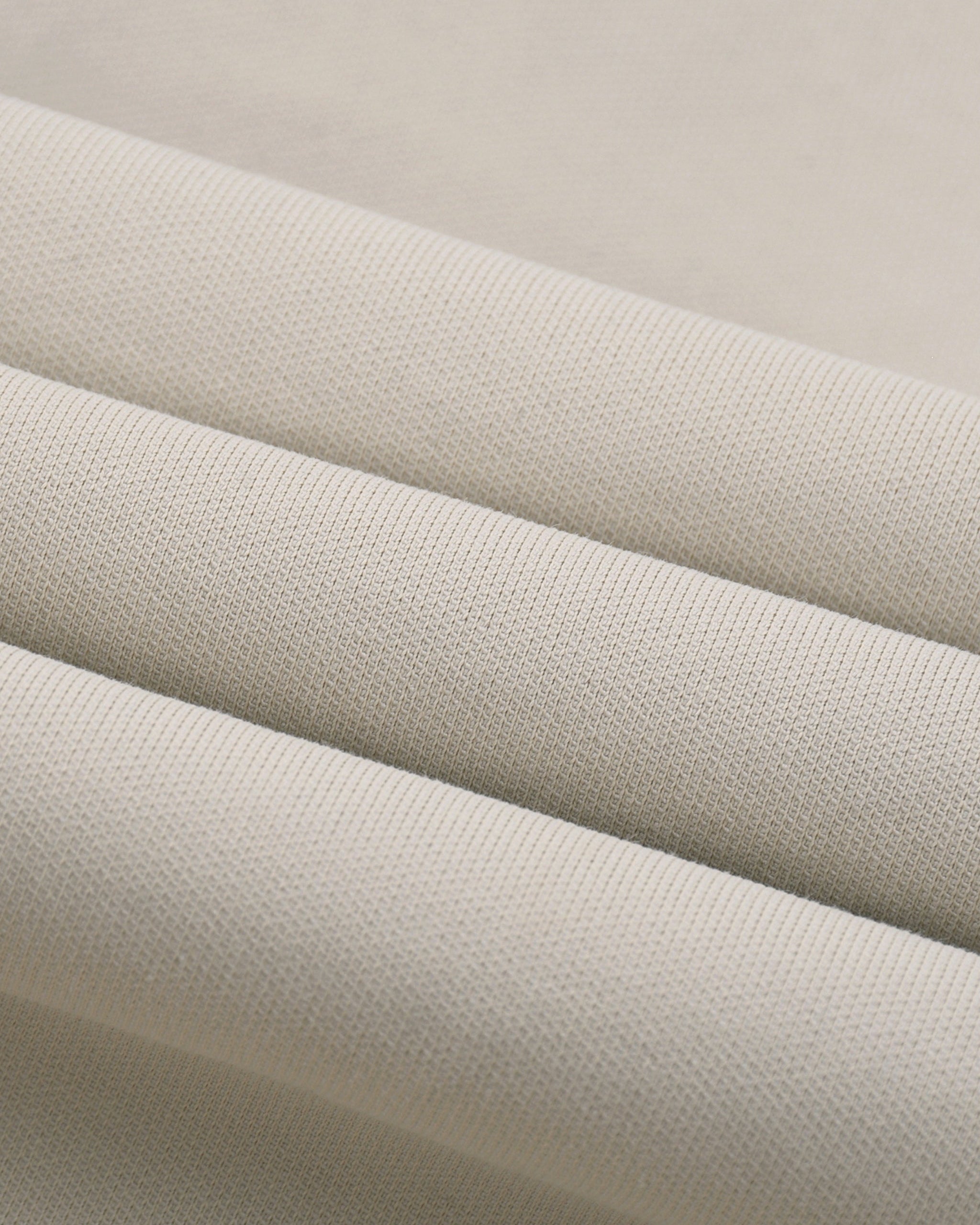 Close-up of beige fabric with a subtle texture