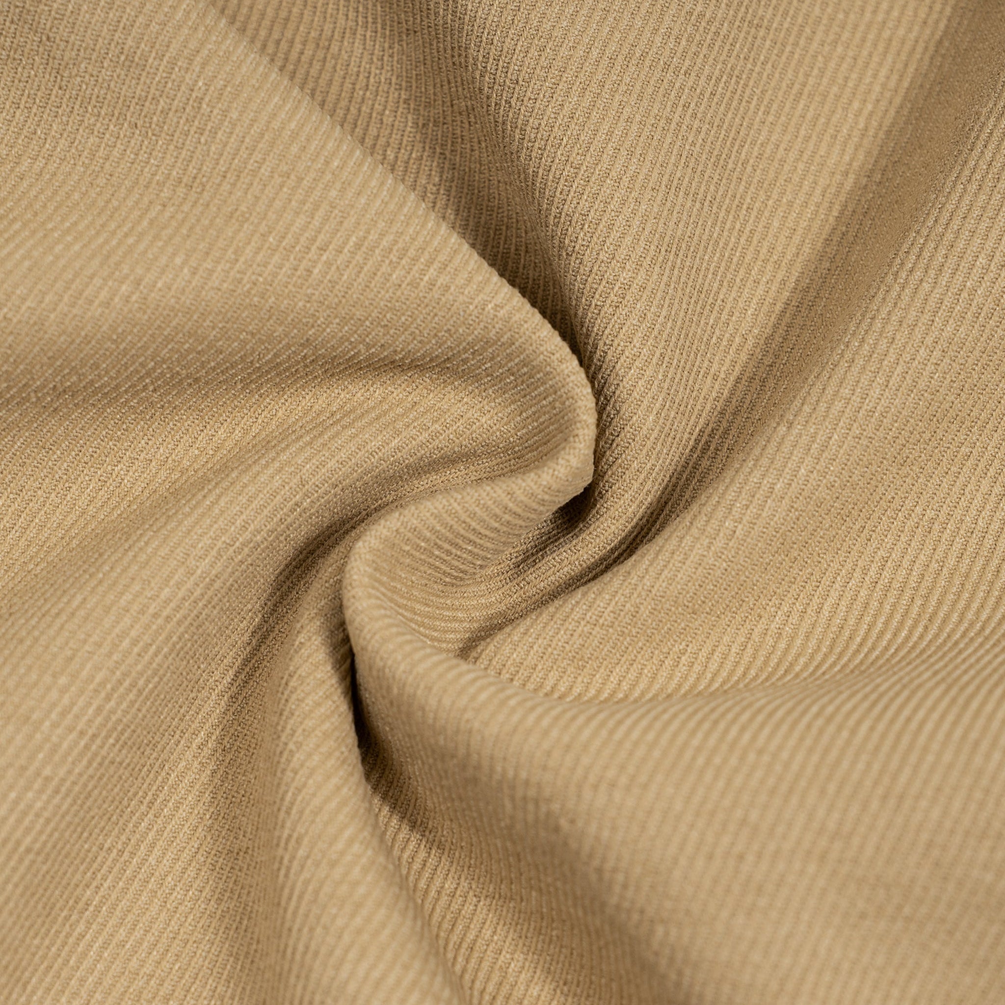 Close-up of beige fabric with folds