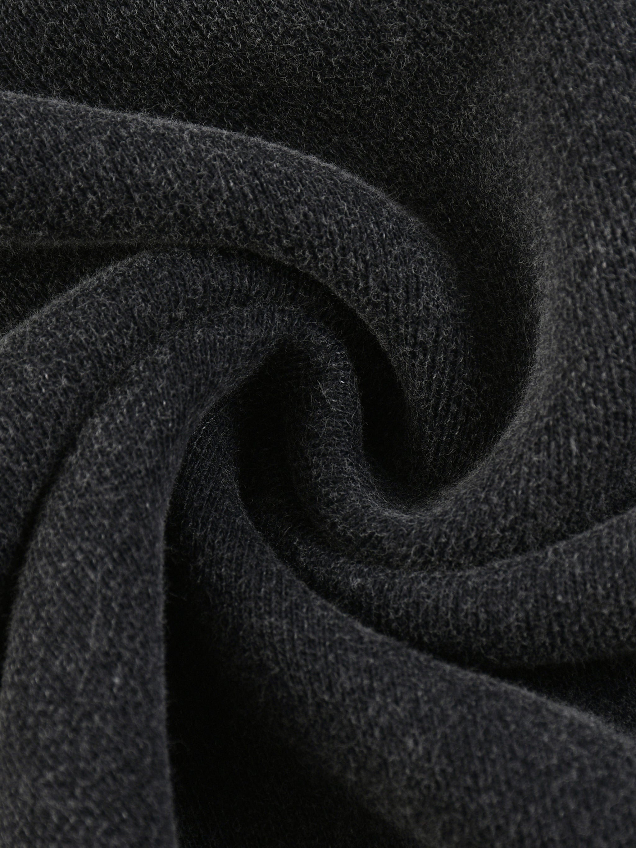 Close-up of dark gray fabric with a textured pattern