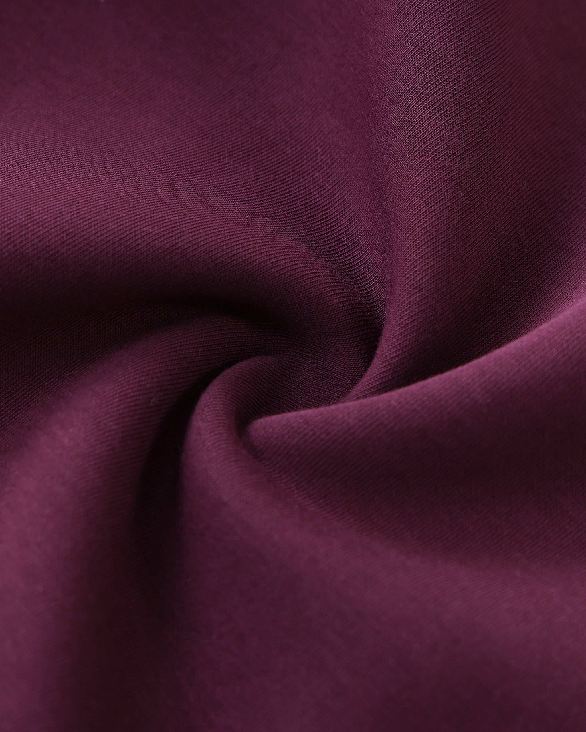 Close-up of purple fabric with folds