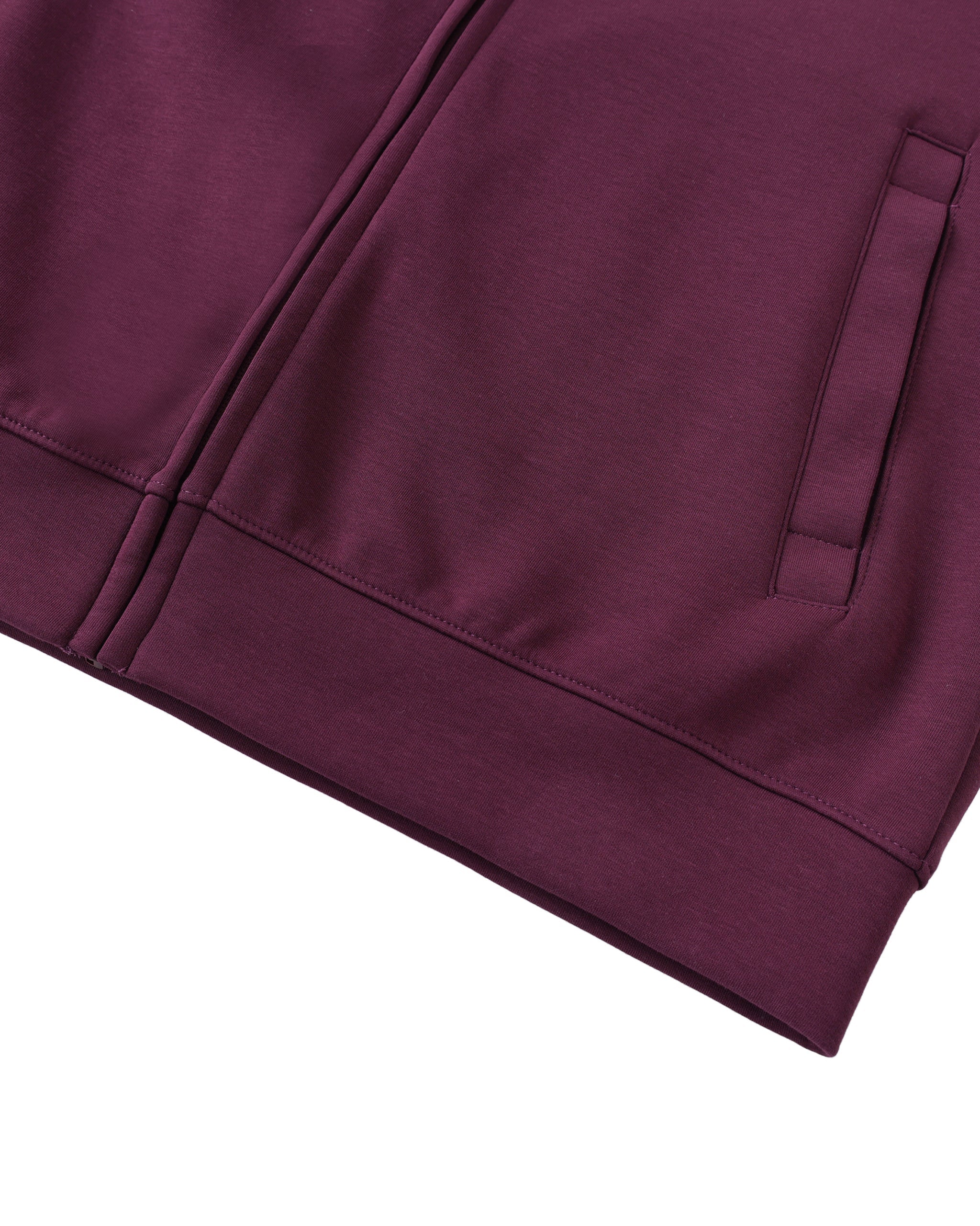 Close-up of a maroon garment with a pocket on a white background