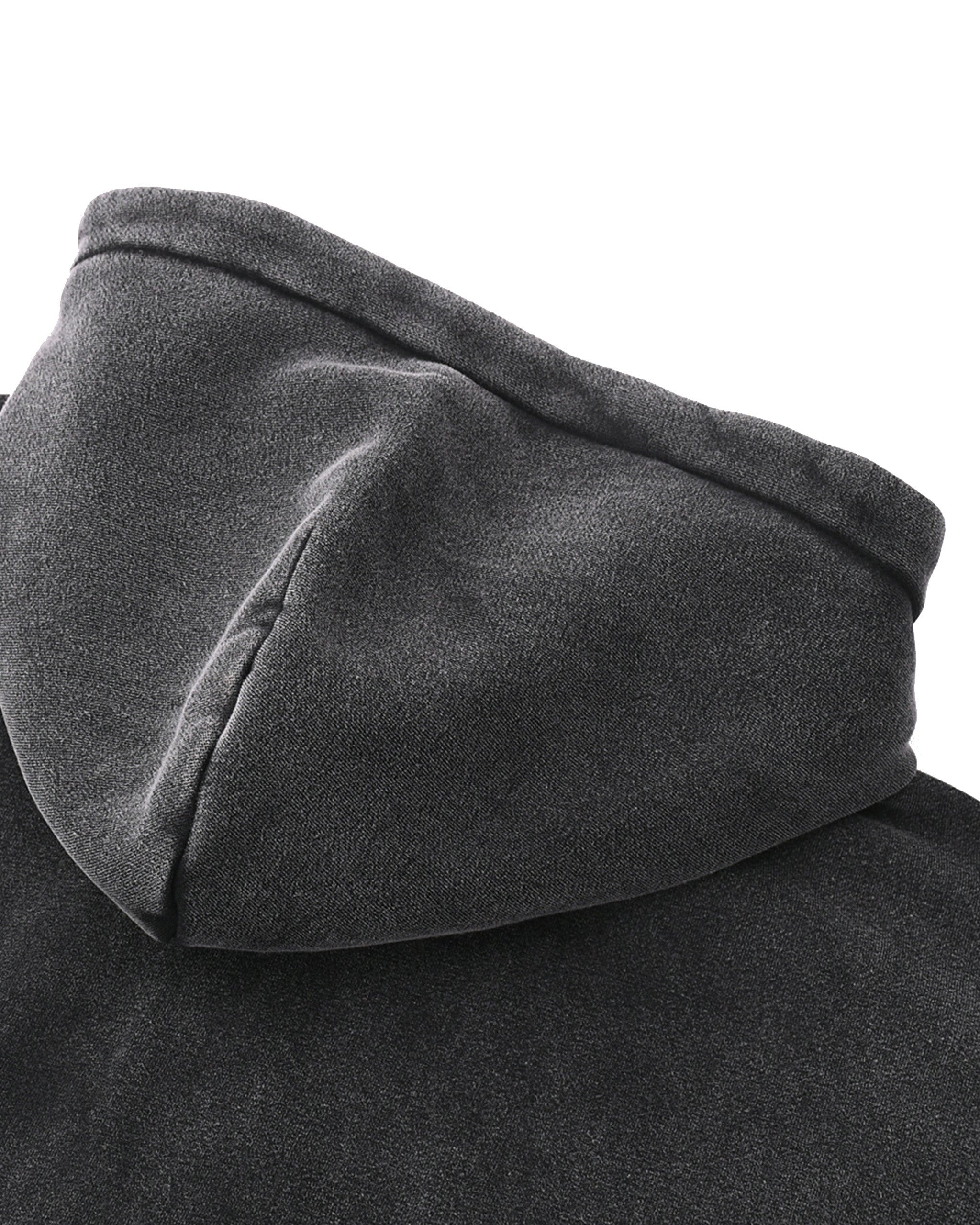 Close-up of a dark gray hooded garment on a white background