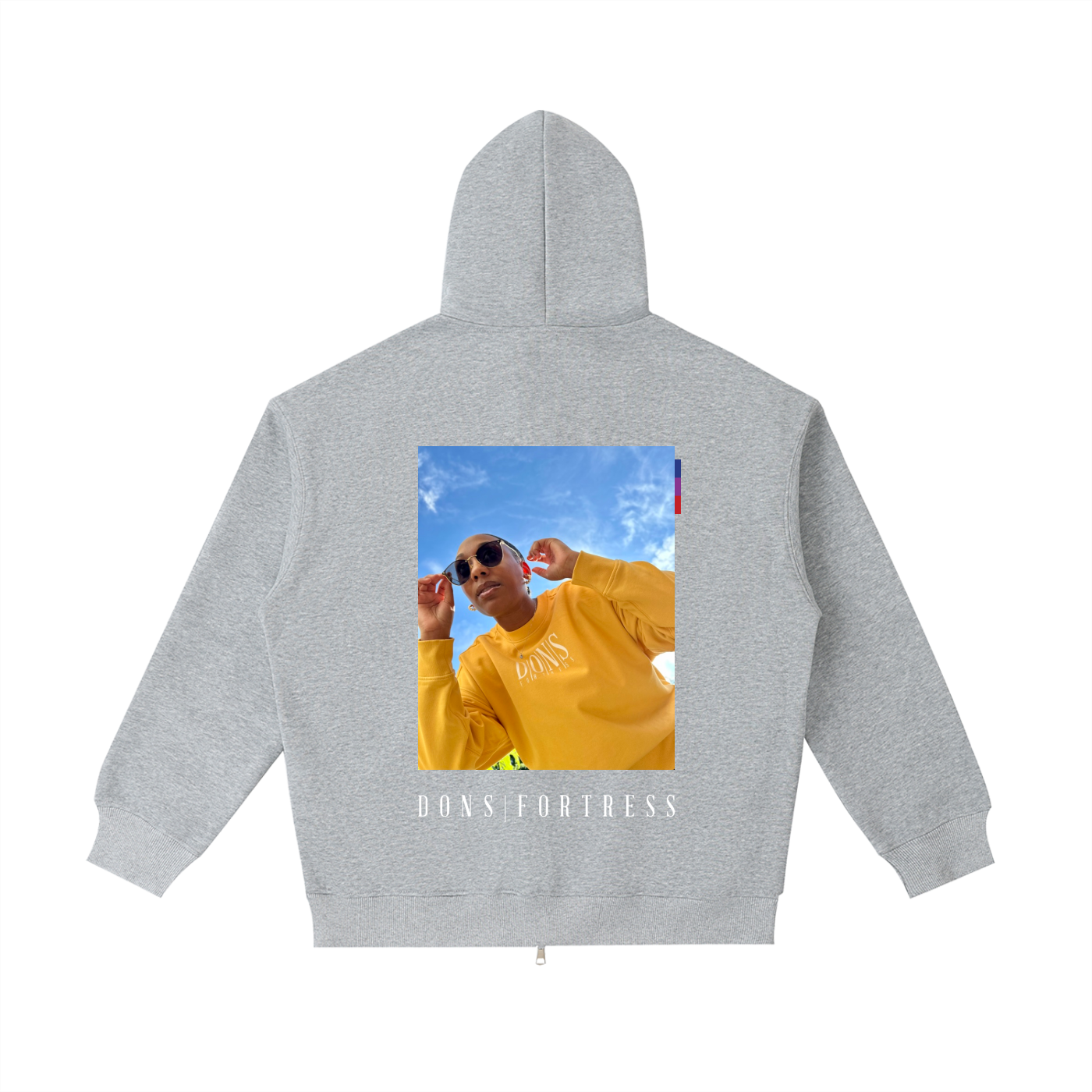 Gray hoodie with a printed design on the back featuring a person in a yellow shirt and sunglasses against a blue sky.