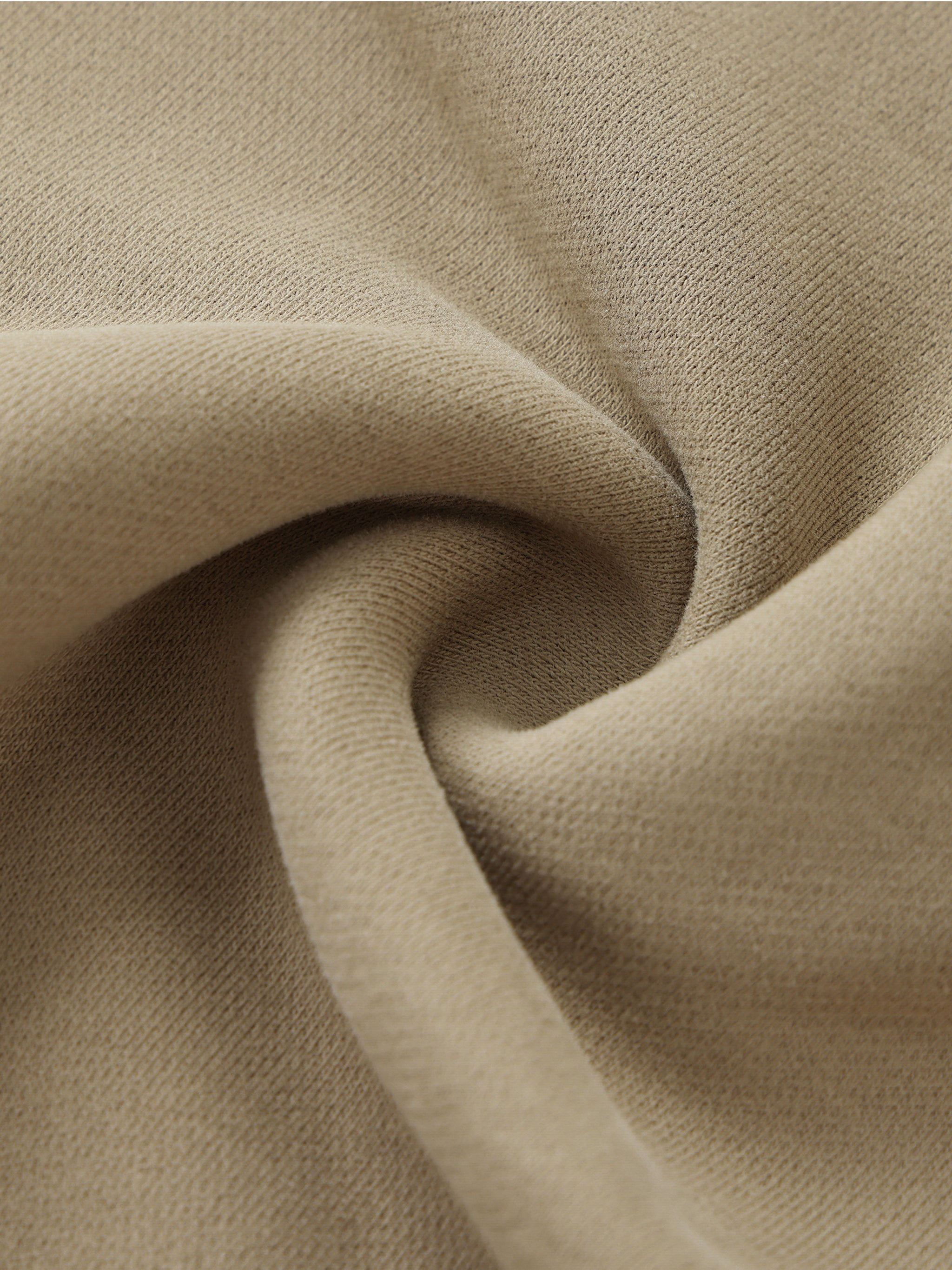 Close-up of beige fabric with folds