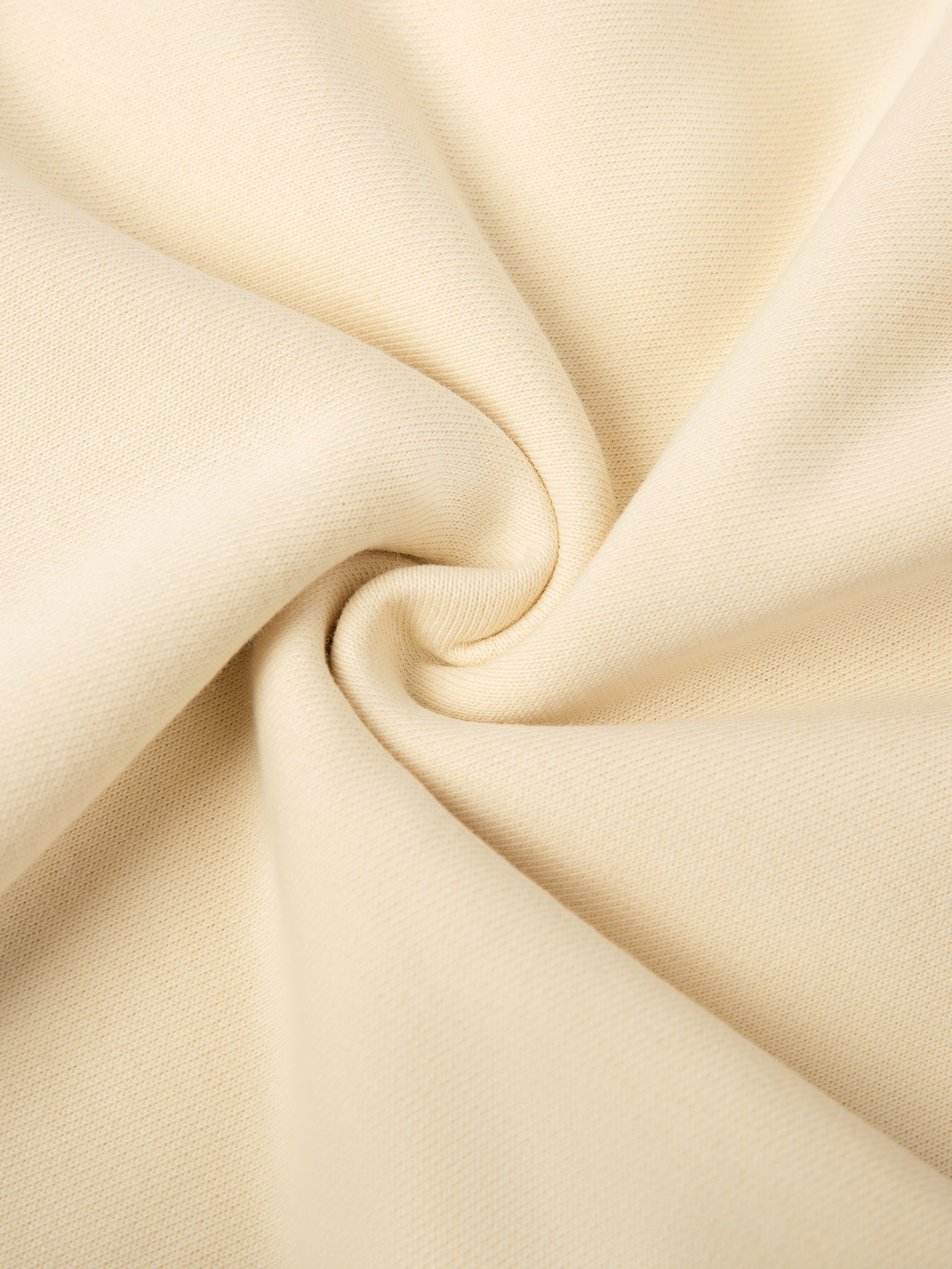 Close-up of beige fabric with folds