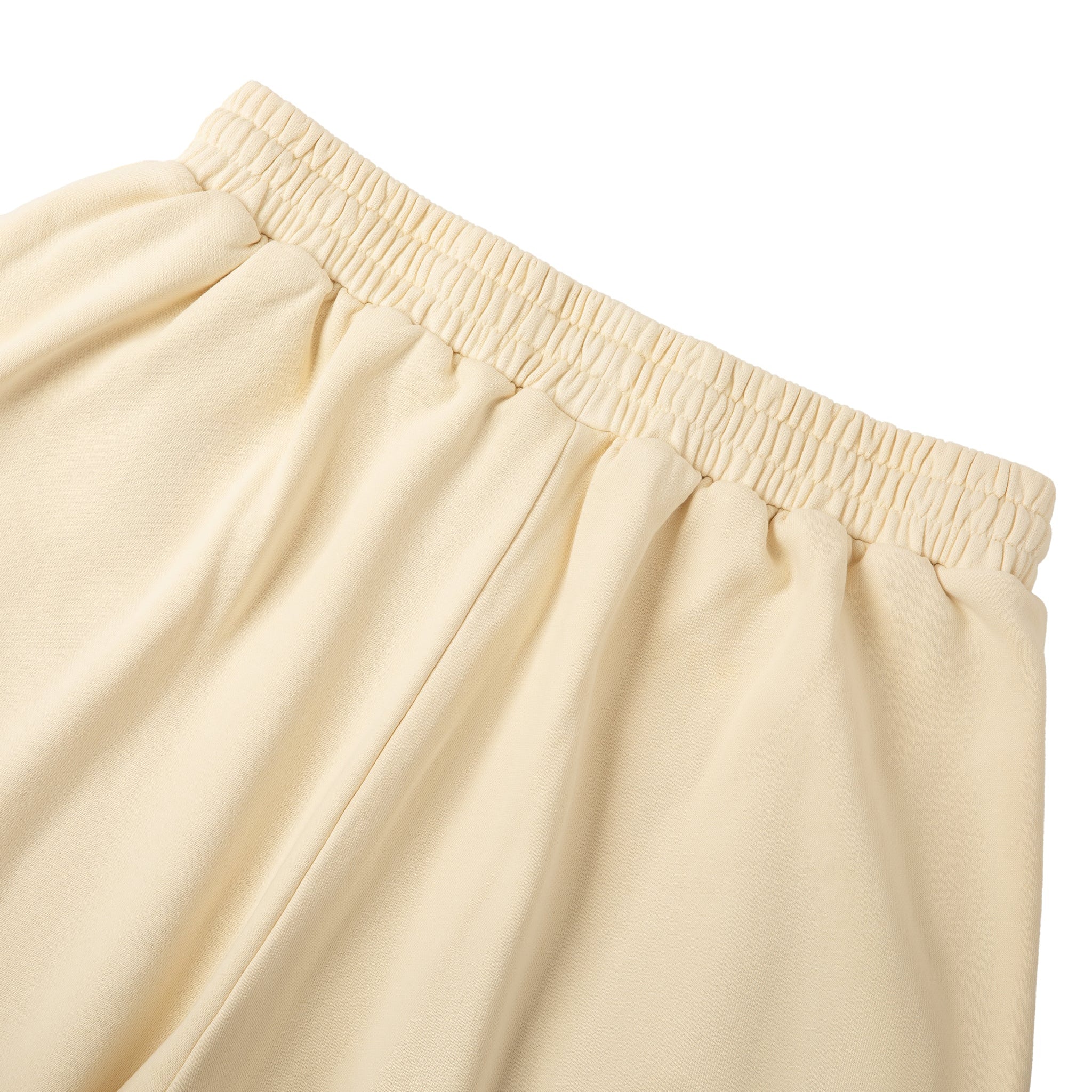 Beige pants with an elastic waistband on a white background