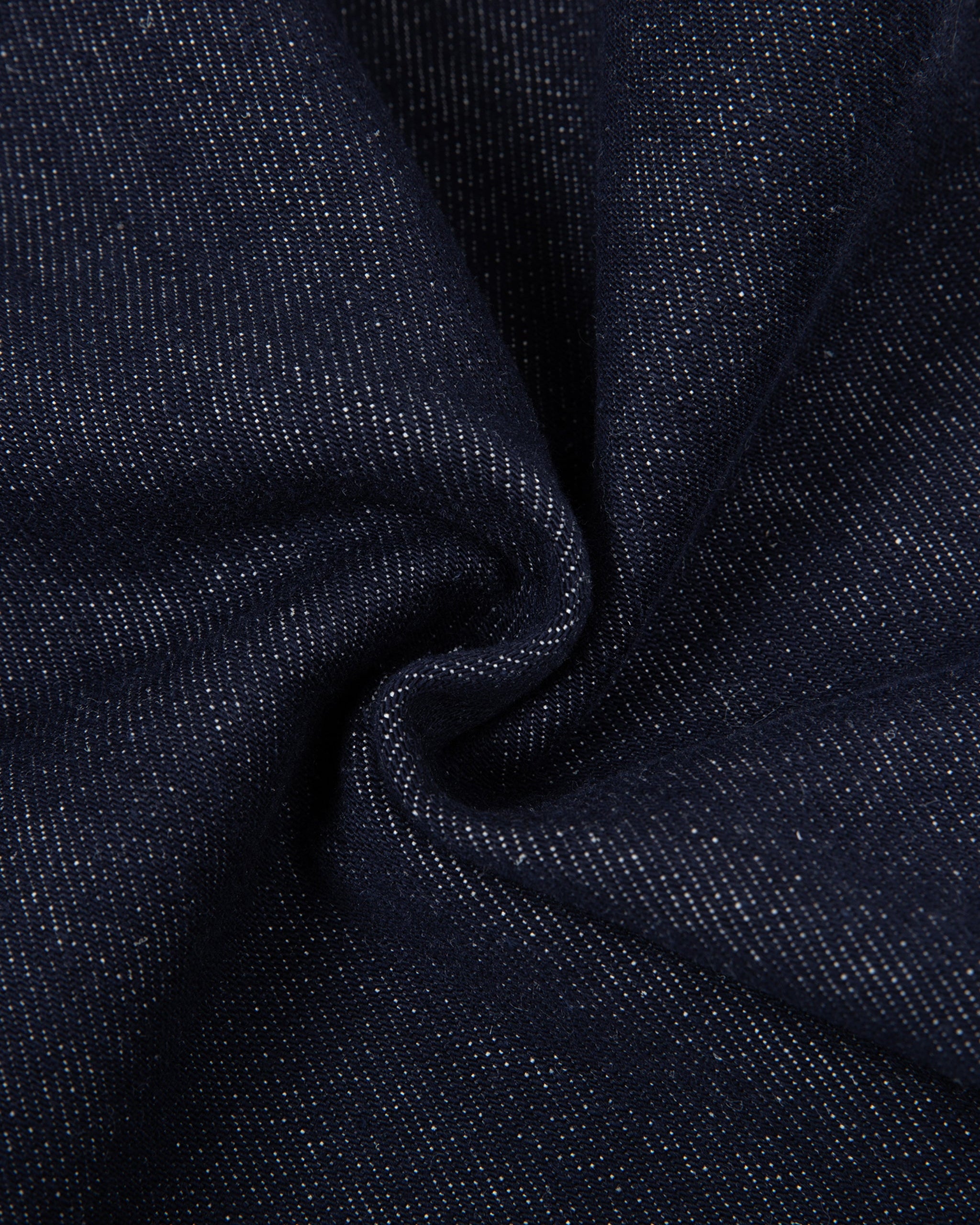 Close-up of dark blue fabric with a textured pattern