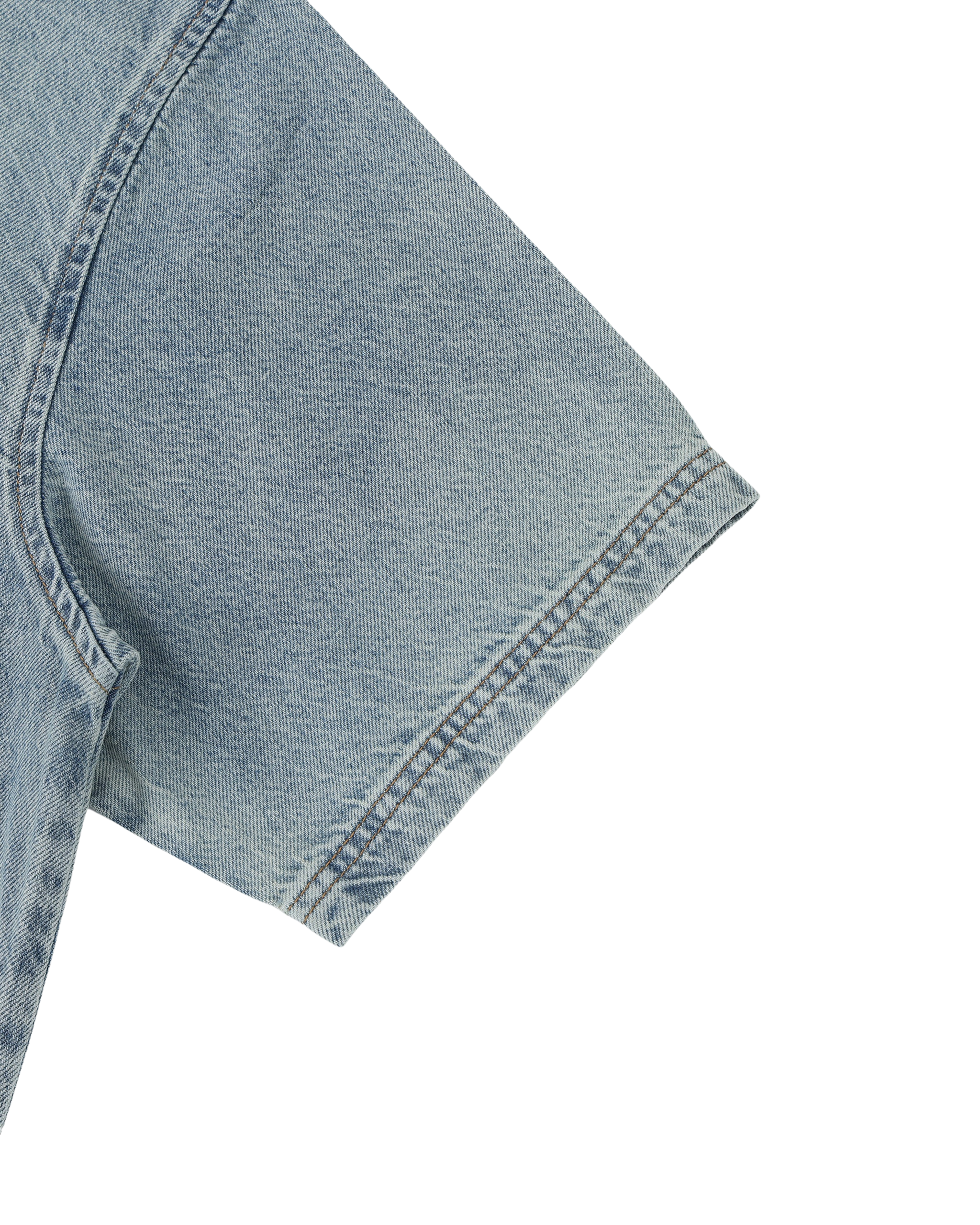 Close-up of a blue denim fabric corner on a white background