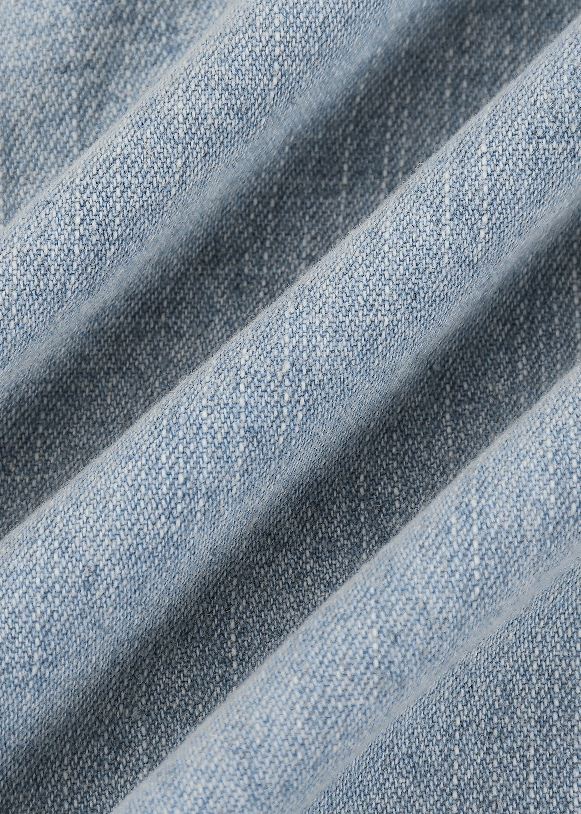 Close-up of blue denim fabric with visible texture