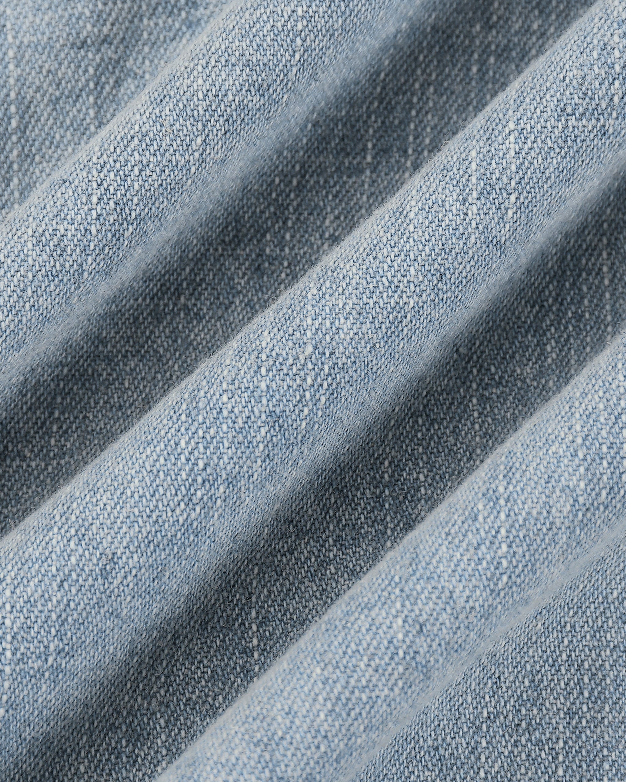 Close-up of blue denim fabric with visible texture